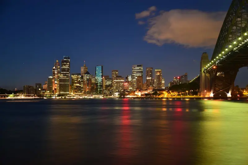 Sydney Harbour and the Opera House lit up at night