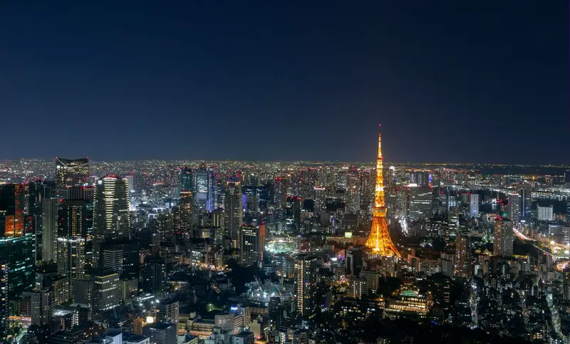 Tokyo skyline at night with Tokyo Tower glowing orange